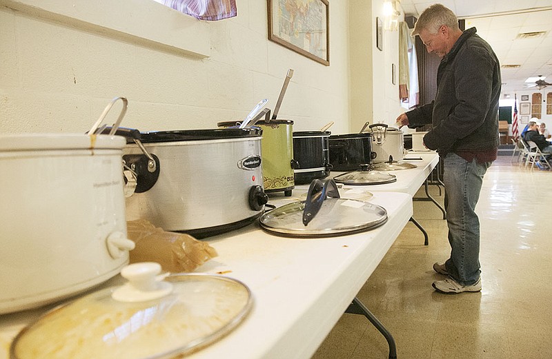 Rick Railton of Fulton packs up his crock pot full of chili Saturday after the annual chili and pie cookoff at the Fulton VFW. Railton's wife cooked the chili, which took second place in the mild chili category.