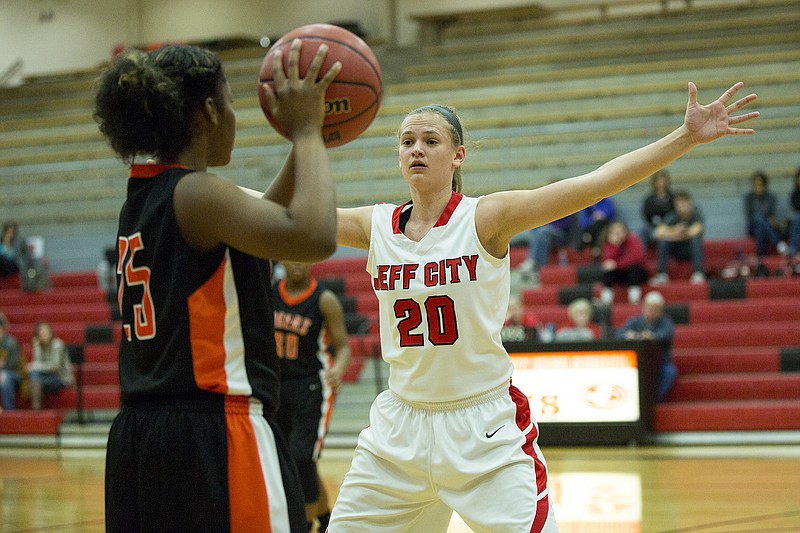 Jefferson City's Kaley Ruff keeps her eye on Waynesville's Janise Simmons Saturday afternoon at Fleming Fieldhouse.
