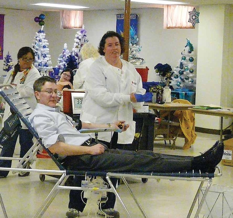 Philip Burger donating blood at the St. Paul's Lutheran Blood Drive held Wednesday, Jan. 22.  

