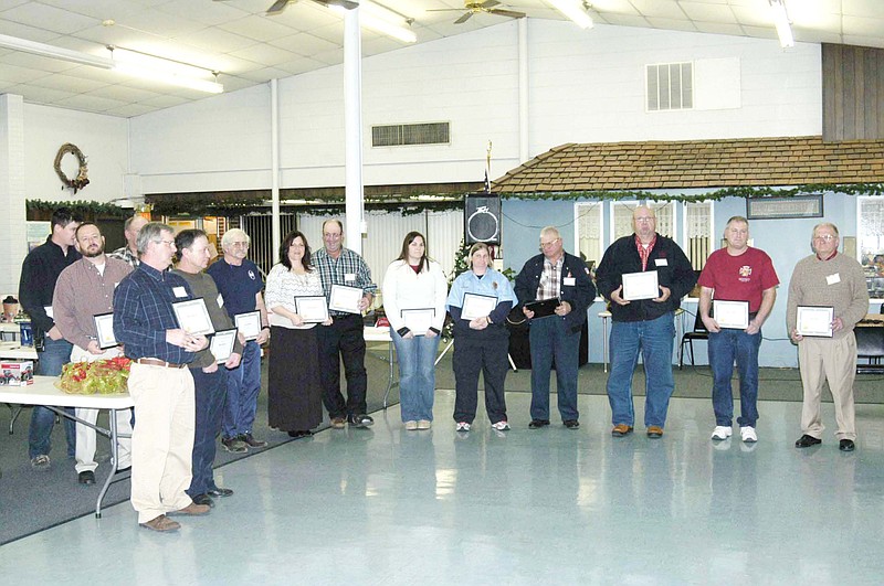 Many of the 30 California Rural Fire Protection District firefighters are present to accept certificates of honor at the Chamber of Commerce annual dinner meeting Saturday, Jan. 25.