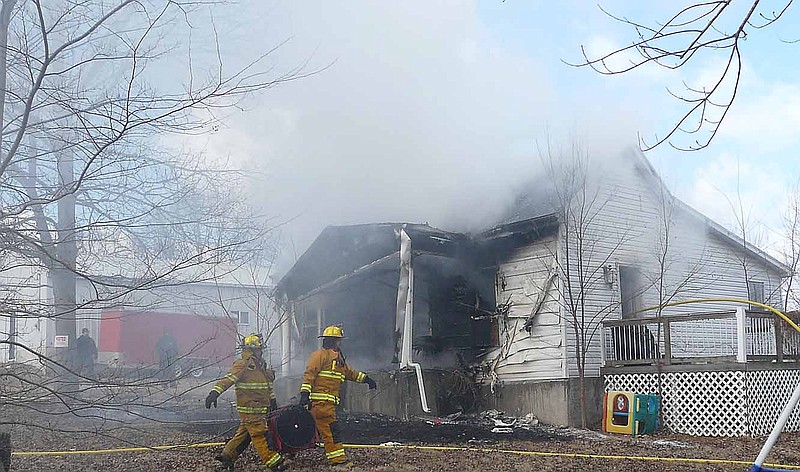 Smoke was pouring from the house at 600 E. Forest Street in California, Wednesday, Jan. 22.
