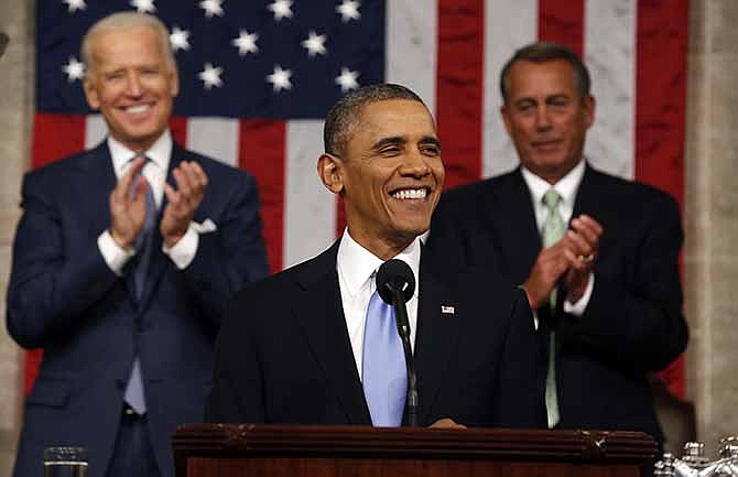 President Barack Obama delivers the State of Union address before a joint session of Congress in the House chamber Tuesday, Jan. 28, 2014, in Washington, as Vice President Joe Biden, and House Speaker John Boehner of Ohio, applaud.