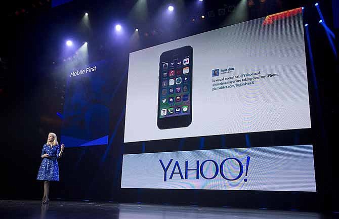 In this Tuesday, Jan. 7, 2014, file photo, Yahoo president and CEO Marissa Mayer speaks during a keynote address at the International Consumer Electronics Show, in Las Vegas.