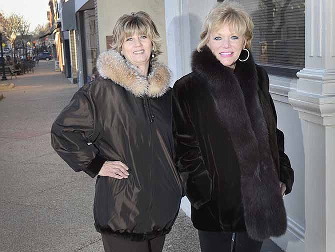 Jaylena Phillips (left) and Lynette Wiles model coats sold at Saffees in downtown Jefferson City.