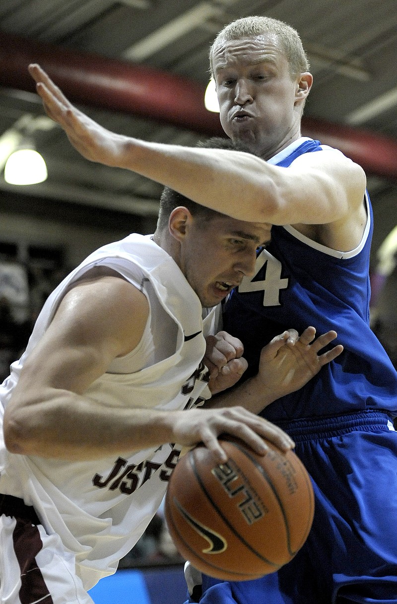 Halil Kanacevic of Saint Joseph's finds his way to the basket blocked by John Manning of Saint Louis during Wednesday night's game in Philadelphia.