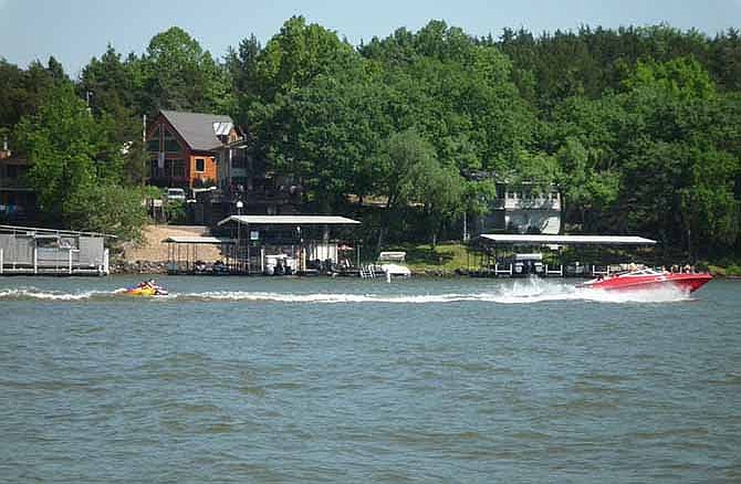 In this July 2, 2012, file photo, people enjoy the cool waters after accessing the Lake of the Ozarks west of Camdenton.