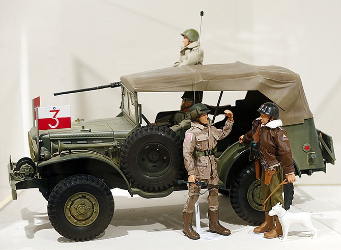Gen. George Patton G.I. Joe action figure, right, and other G.I. Joes are on display at the New York State Military Museum in Saratoga Springs, N.Y. A half-century after the 12-inch doll was introduced at a New York City toy fair, the iconic action figure is being celebrated by collectors with a display at the military museum, while the toy's maker plans other anniversary events to be announced later this month. 
