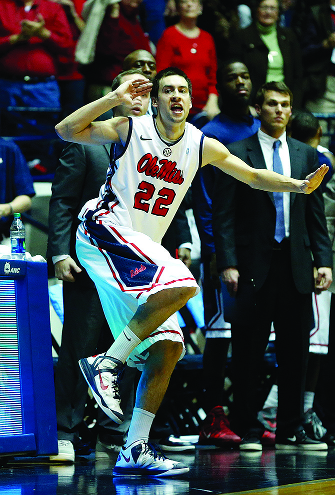 Mississippi guard Marshall Henderson (22) celebrates the win over Mississippi State with a quick dance on the floor Saturday in Oxford, Miss.