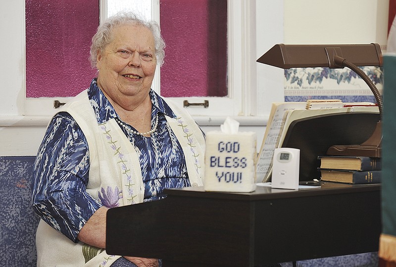 Arline Mueller is seated at the organ in St. Paul's Lutheran Church in Babbtown, where she has been found nearly every Sunday for 65 years.
