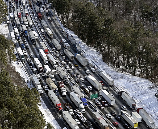 Traffic is snarled along the Interstate 285 perimeter, north of the metro area after a Jan. 29 winter snowstorm, in Atlanta. 
