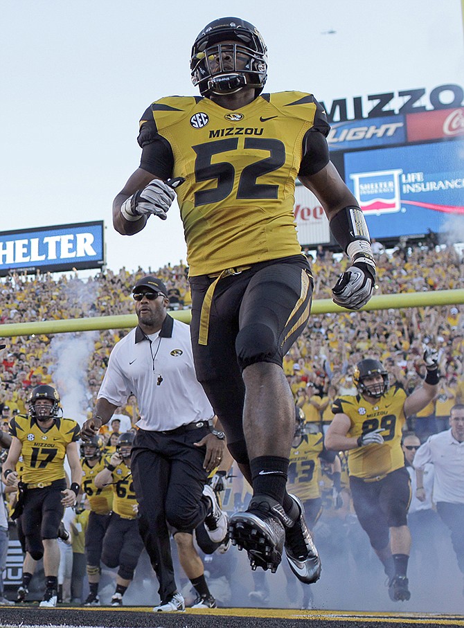 In this Sept. 8, 2012, file photo, Missouri's Michael Sam runs onto the field along with his teammates before the start of a game against Georgia in Columbia. Sam hopes his ability is all that matters, not his sexual orientation.
