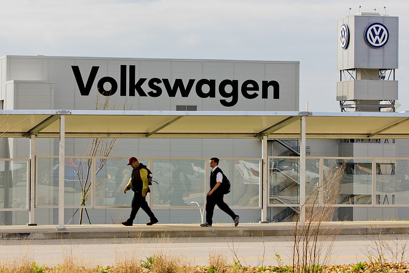 In this March 21, 2012, file photo, workers walk by the Volkswagen AG plant in Chattanooga, Tenn. 