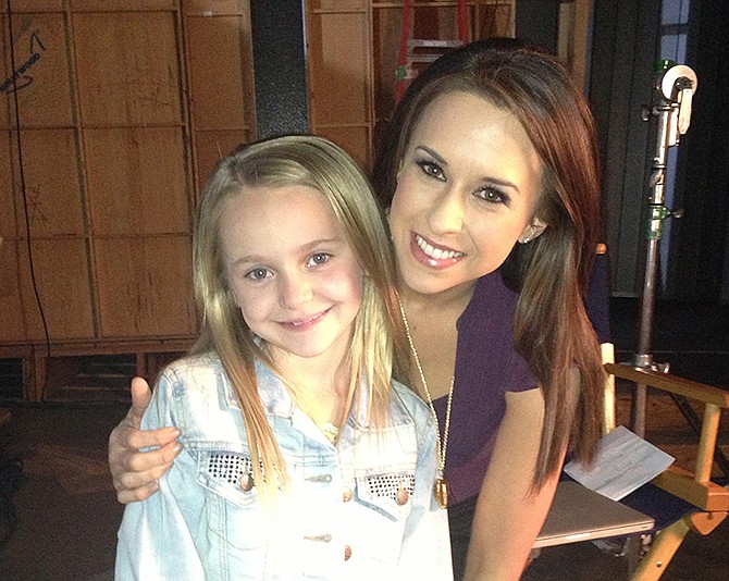 Avery Phillips poses with actress Lacey Chabert on the set of the Lifetime movie "Non-Stop."