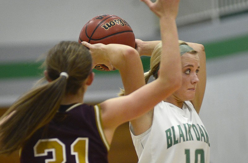 Sara Jones of Blair Oaks looks to pass the ball to a teammate during Thursday night's game against the Eldon Lady Mustangs in Wardsville.