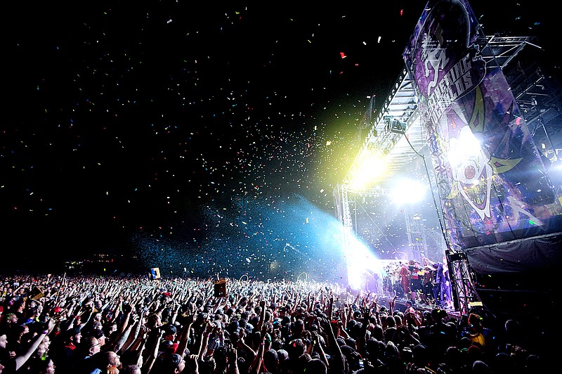 In this Aug. 11, 2012 file photo, confetti is released over the crowd for the grand finale of Insane Clown Posse's performance on the last night of the Gathering of the Juggalos near in Cave-In-Rock, Ill. Organizers of a yearly outdoor festival headlined by Insane Clown Posse announced a two weeks ago the event was moving to CryBaby Campground in Kaiser. However, organizers recently announced they are looking for a new location after venue owners declined to host the event following continued community outcry against the festival's presence. 