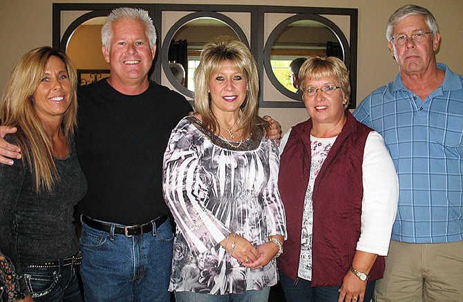 From left, siblings Deidre Handtmann, 50; John Blankendall, 53; Sandy Watkins, 54; Buddine Bullinger, 56; and John Maixner, 57, gather in October 2013 at Handtmann's home in Bismarck, N.D., where they were reunited for the first time. The siblings were born in North Dakota and separately adopted at infancy.