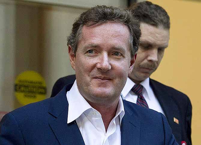 In this Dec. 20, 2011 file photo, Piers Morgan, host of CNN's "Piers Morgan Tonight," leaves the CNN building in Los Angeles. 