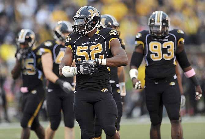 In this Sept. 17, 2011, file photo, Missouri defensive lineman Michael Sam takes up his position during the first quarter of an NCAA college football game against the Western Illinois in Columbia, Mo. 