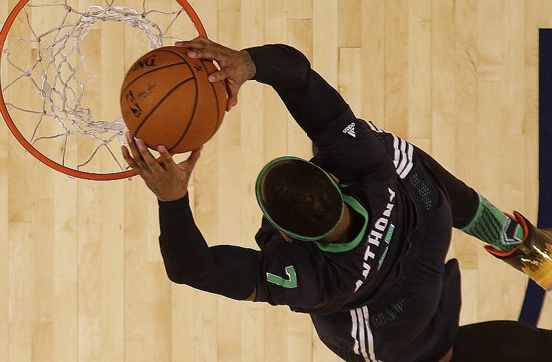 Carmelo Anthony of the East dunks the ball during Sunday night's NBA All-Star Game in New Orleans.