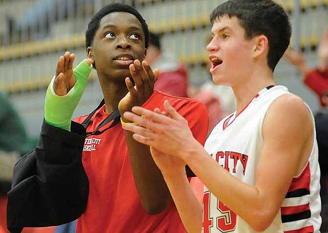 O.G. Anunoby (left) and Seth Stegeman cheer for their Jays teammates Saturday at Fleming Fieldhouse.