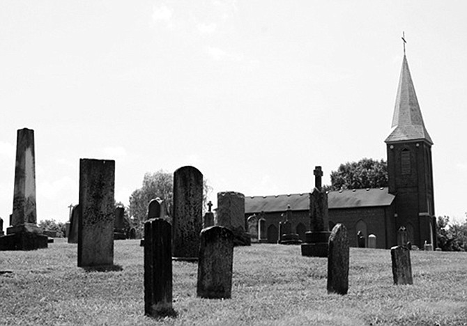 Assumption Catholic Church and Cemetery as it looks from the southwest. The church has been placed on the National Register of Historic Places.