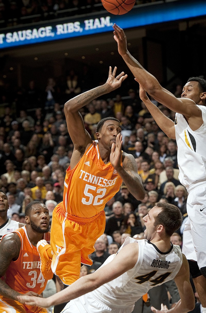 Tennessee's Jordan McRae (center) is called for an offensive foul against Missouri's Ryan Rosburg (bottom) as Johnathan Williams III tries to block the shot during Saturday's game at Mizzou Arena.