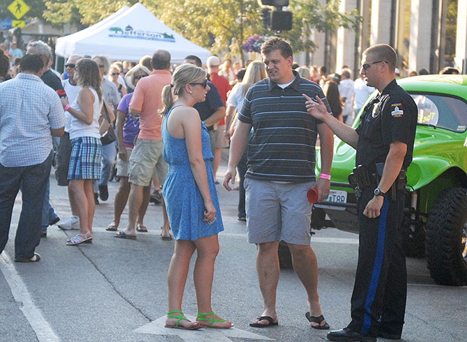 In this June 2012 file photo, Jefferson City police keep an eye on the crowd during a Thursday Night Live event held on High Street.