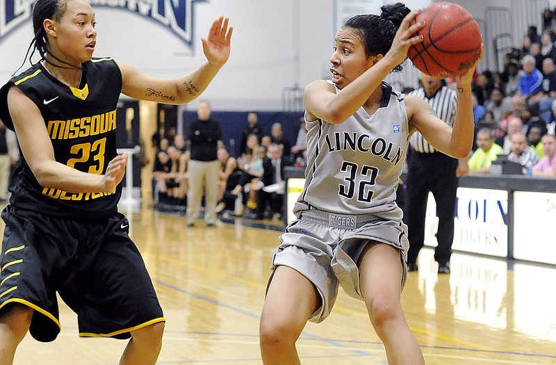 Jennifer Rosado of Lincoln looks to pass during Wednesday night's game at Jason Gym.