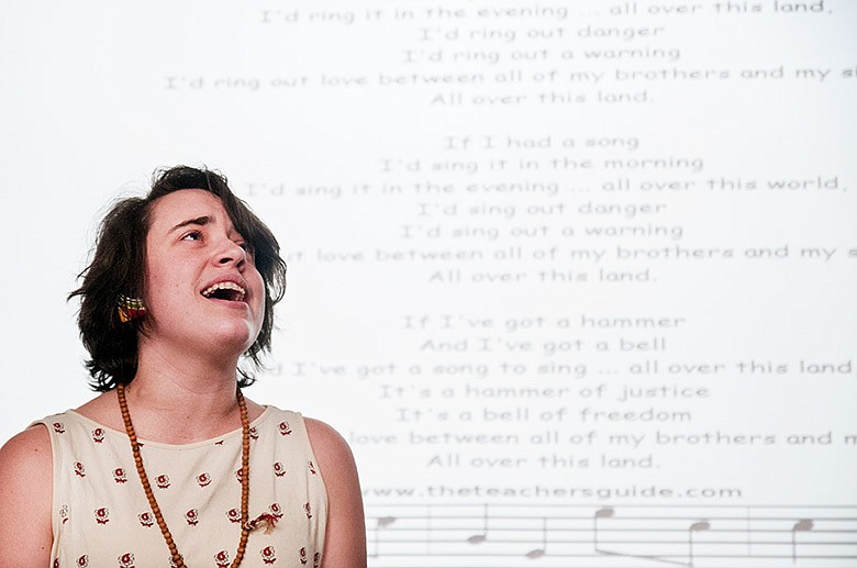 Abigail Stokes, Westminster College student, sings "If I Had a Hammer" by Pete Seeger Wednesday during a memorial to honor the American folk musician who died on January 27. The Rubato Music Club and Spiritual Life at Westminster organized the event. Stokes said gave a speech, saying her mother used to sing to her Seeger's song, "Abby Yo Yo" when she was young. She added that she identified with Seeger as a humanitarian because his music always came with a moving message.