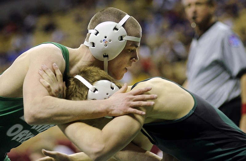 Blair Oaks' Alex Gaydos (left) and Whitfield's Kurtis Hahn lock up in their 138-pound match Thursday in the Class 1 state tournament at Mizzou Arena.