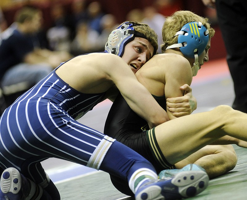 Nick Gaines of Helias works on Shaun Beeman of Fort Zumwalt North during their 106-pound match Thursday in the opening round of the Class 3 state wrestling tournament at Mizzou Arena.
