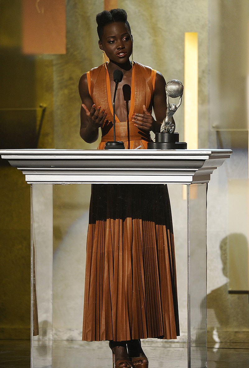 Lupita Nyong'o accepts the award for outstanding supporting actress in a motion picture for "12 Years a Slave" at the 45th NAACP Image Awards at the Pasadena Civic Auditorium on Saturday.