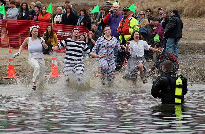 Members of the Jefferson City Correctional Center's team take their plunge into the 34-degree Lake of the Ozarks at the Special Olympics' 19th Annual Polar Plunge on Saturday.