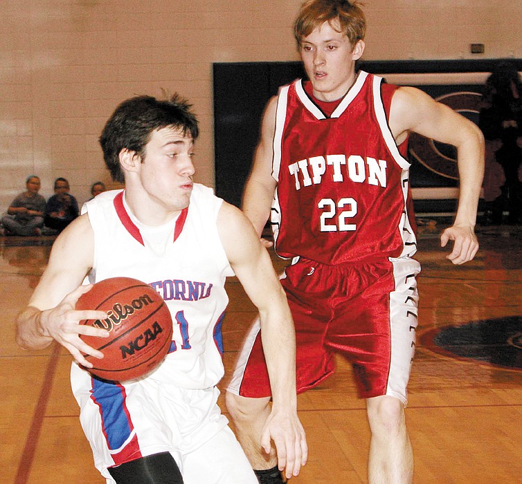 California's Jerry Lutz (21) drives around Tipton's Logan Hirst during the first quarter of the Pintos' Courtwarming game Friday at California.