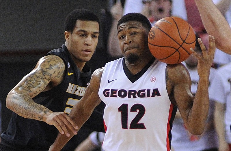 Kenny Gaines of Georgia steals the ball from Jabari Brown of Missouri (left) during Tuesday night's game in Athens, Ga.