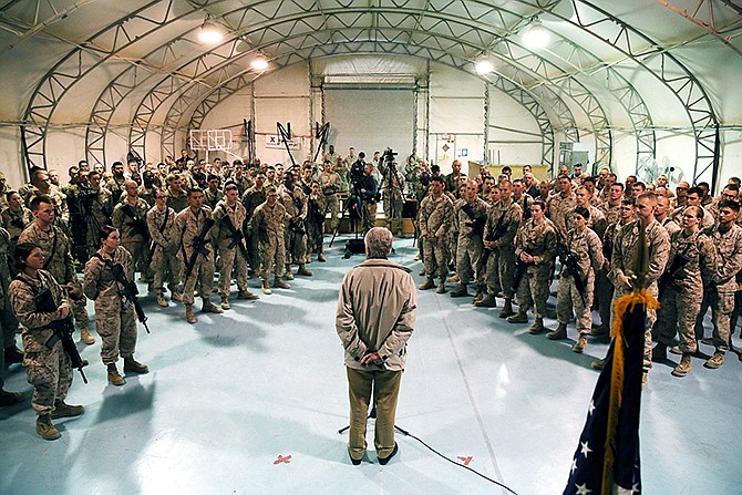 Defense Secretary Chuck Hagel speaks with U.S. troops at Camp Bastion, Afghanistan. President Barack Obama has ordered the Pentagon to plan for a full American withdrawal from Afghanistan by the end of this year should the Afghan government refuse to sign a security agreement with the U.S., the White House said Tuesday.