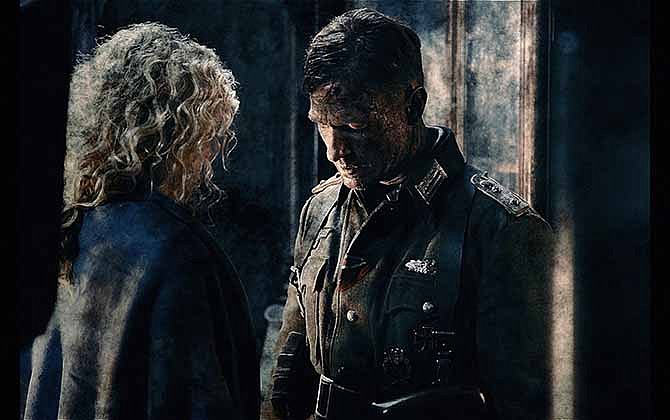 This image released by Sony Pictures shows Yanina Studilina, left, and Thomas Kretschmann in a scene from "Stalingrad."