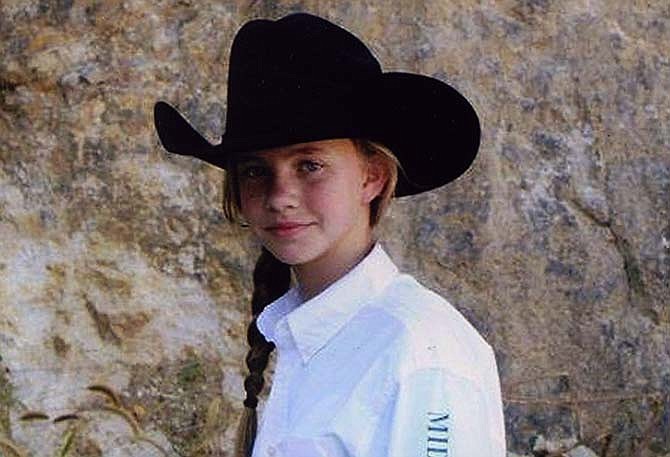 Catie Dampf rides as a member of the Mid-Missouri Bit & Bridle Drill Team, which performs the national anthem for local horse shows and competes nationwide.