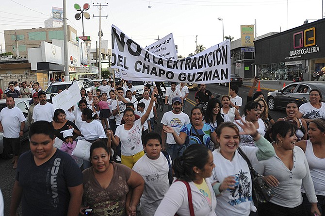 People march Wednesday in support of jailed drug boss Joaquin "El Chapo" Guzman Loera, in the city of Culiacan, Mexico.