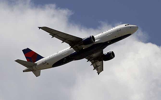 This Monday, Aug. 20, 2012, file photo, shows a Delta Air Lines aircraft taking off at Miami International Airport in Miami. 