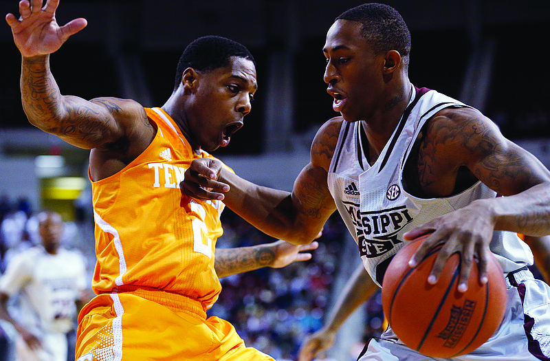 Mississippi State guard Craig Sword (right) dribbles past Tennessee guard Antonio Barton in the first half of Wednesday night's game in Starkville, Miss. Sword, who leads his team in scoring, and the Bulldogs will face the Missouri Tigers this afternoon at Mizzou Arena.