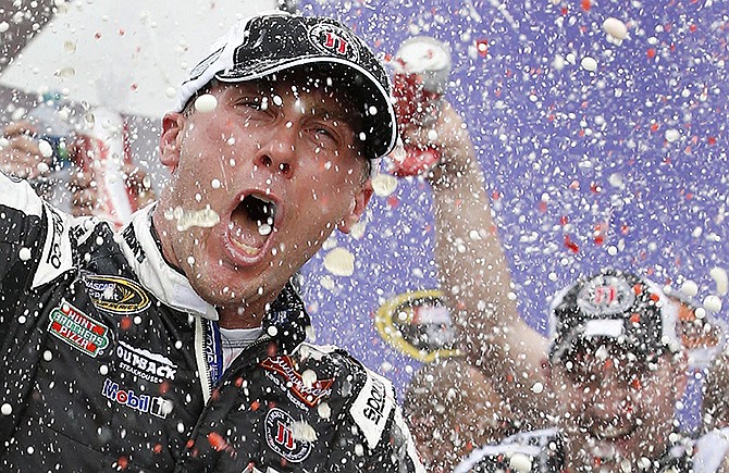 Kevin Harvick celebrates in Victory Lane with his crew after winning The Profit on CNBC 500 on Sunday in Avondale, Ariz.