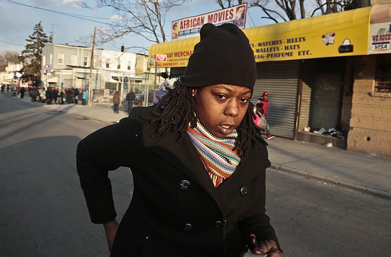 Naquasia LeGrand walks to catch a subway for work in the Carnarsie section of Brooklyn, N.Y.