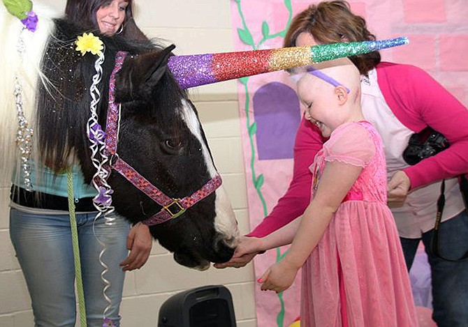 Summer Warren, a first-grader who has been battling an inoperable cancer, gets to know her "unicorn" after teachers and community volunteers turned a school gym into a giant castle. 