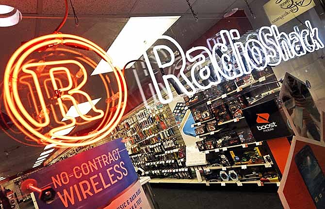 This Tuesday, March 4, 2014, photo, shows Radio Shack store in downtown Cincinnati. RadioShack said it plans to close up to 1,100 stores in the U.S. and reported a wider quarterly loss after a disappointing holiday season. 