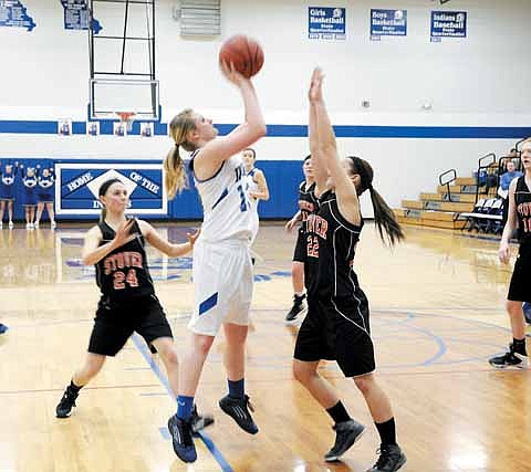 Russellville's Haley Windsor shoots over a Lady Bulldog at the Class 2 District 8 Tourney Feb. 24.