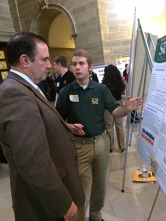 Samuel Turpin, a Jefferson City High School graduate, shares his research Tuesday with Mike Kehoe, left, while at the Capitol. Turpin is a Missouri University of Science and Technology senior.