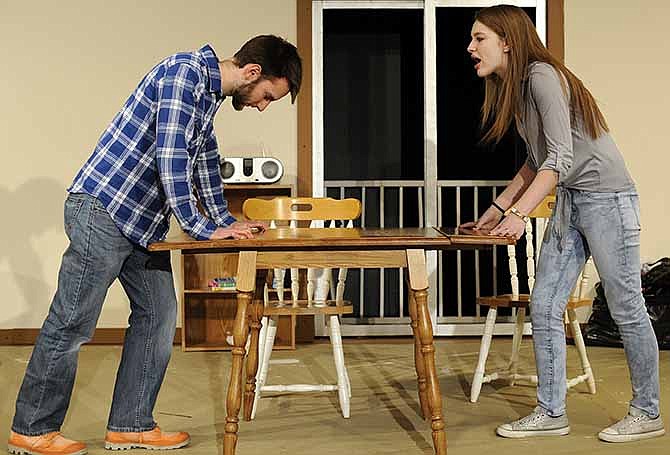 Mark Howard and Mikayla Moore rehearse a scene as cast members prepare for the upcoming production of "The End Came In Spring" at Stained Glass Theatre.