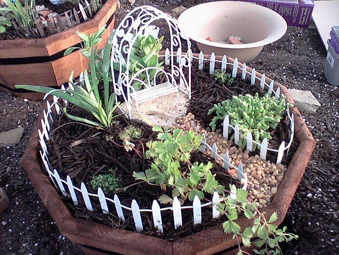 A delightful miniature world has been created at the entrance of Longfellow's Garden Center in Centertown. The 100-square-foot Enchanted Forest may inspire gardeners to add a sort of fairy garden to their outdoor plans this spring.