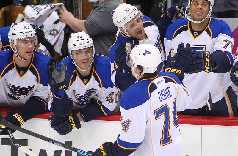 T.J. Oshie is congratulated by the Blues' bench after scoring during the shootout of Sunday night's game against the Wild in St. Paul, Minn.